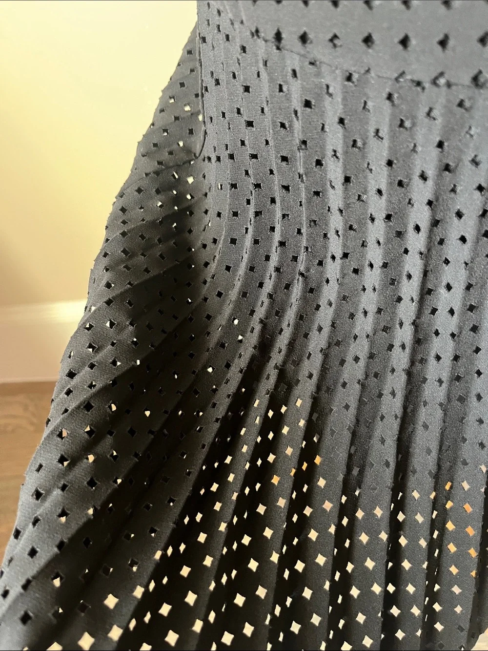 J. Crew black laser cut pleated A-line skirt.